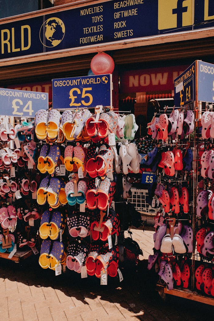 Vibrant arrangement of assorted sandals on sale at a discount store.